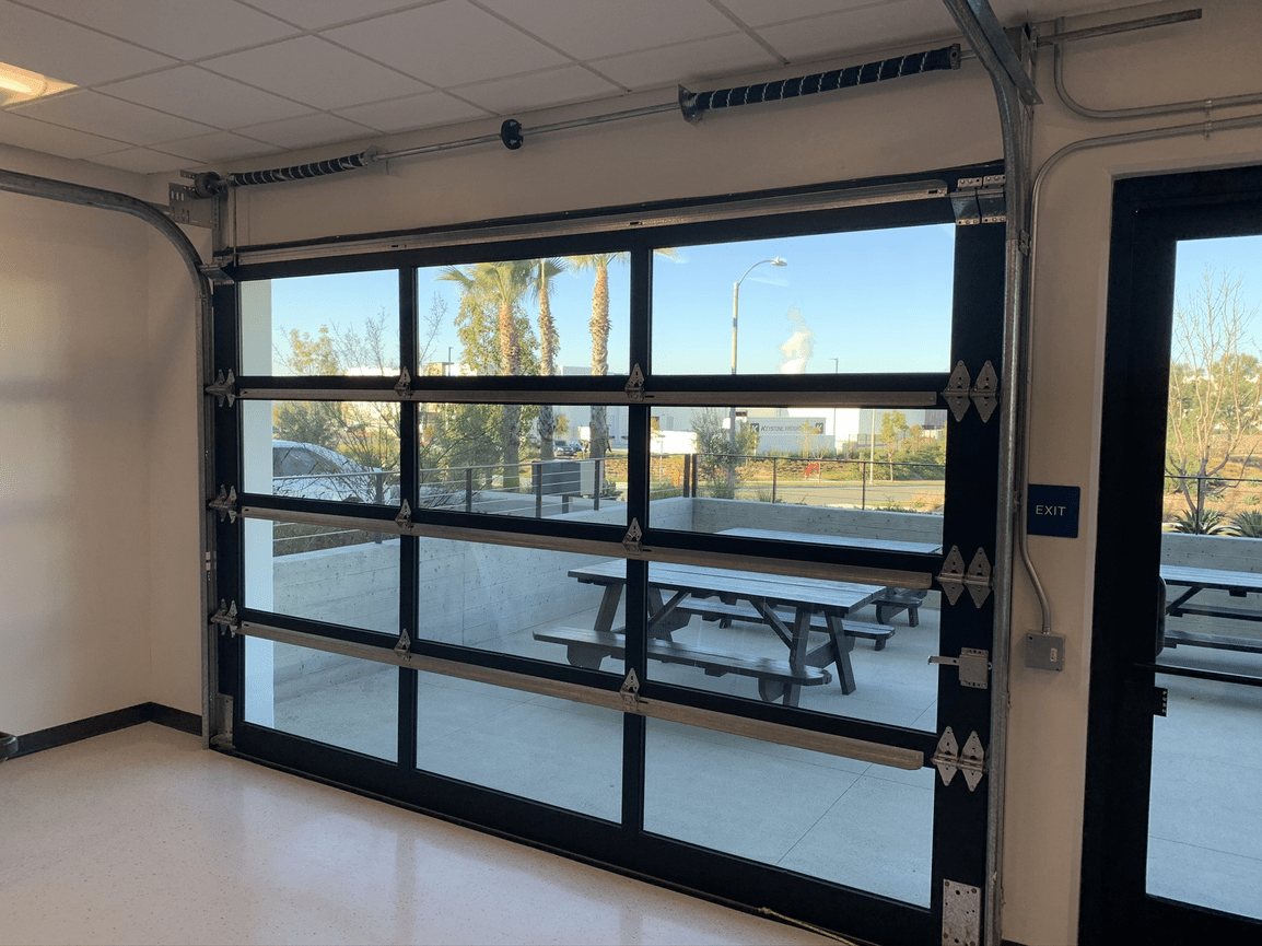 Full-view glass garage door seen from inside a building